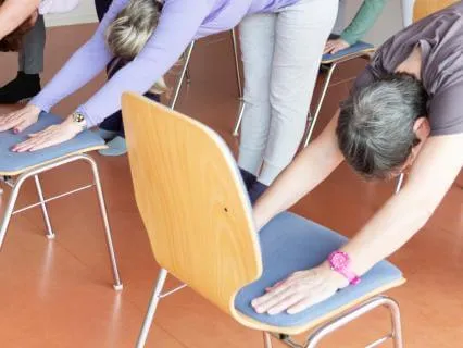 A Quick Yoga Sequence Using Chair At Wall