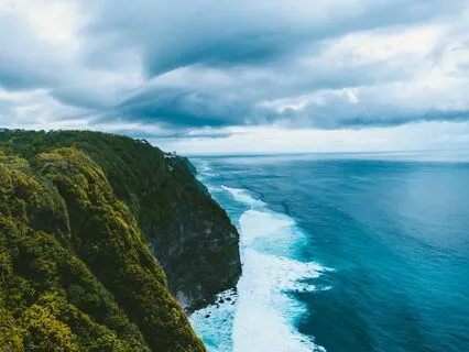 Om Chanting On A Clifftop Overlooking The Ocean