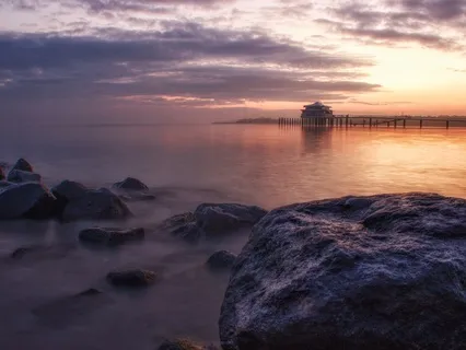 Rocky Shoreline Serenity: Gentle Lapping Waves