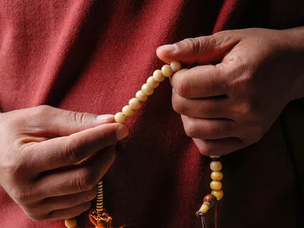 Tibetan Refugee Chanting Om Mani Peme Hung