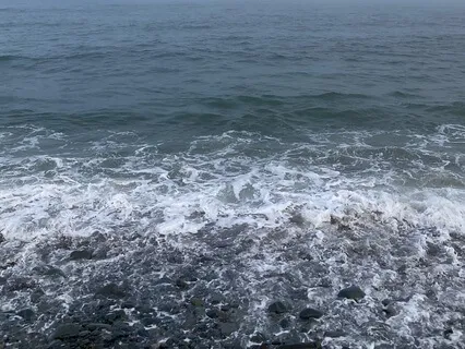 Waves Falling On A Stony Beach
